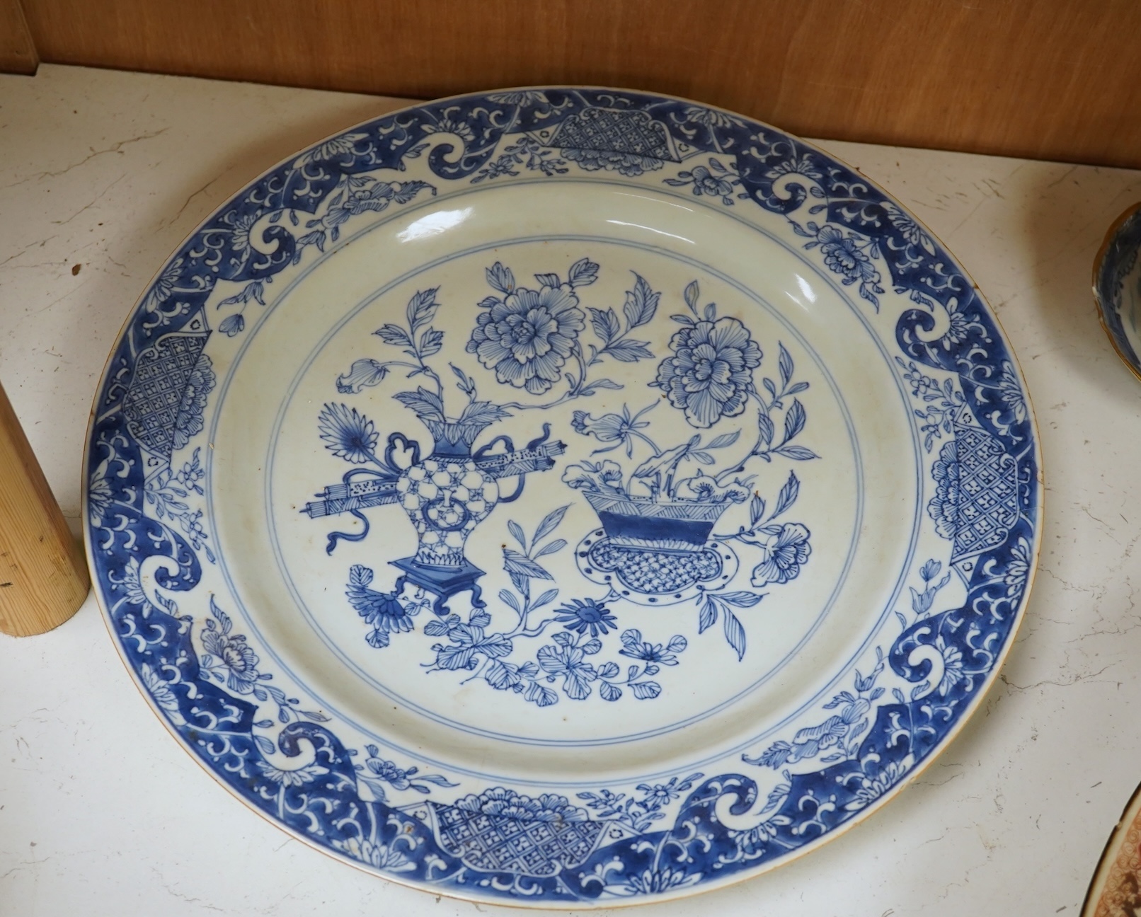 A Worcester teapot, c.1770, an 18th century Chinese famille rose and a blue and white dish, a small blue and white dish, a cup and saucer and teapot, largest dish 39cm (7). Condition - most damaged, cracked or chipped